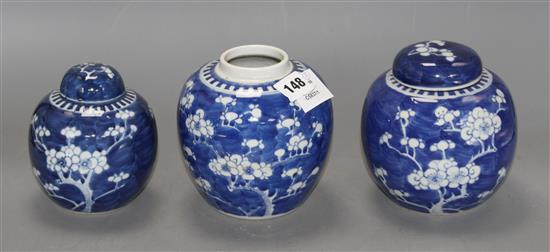 Three Chinese blue and white prunus jars and two covers, early 20th century, height 12cm - 13.5cm